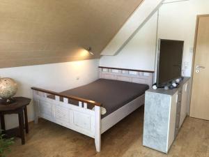 a bedroom with a bed and a tv at Holiday apartment Kromer in Jechtingen