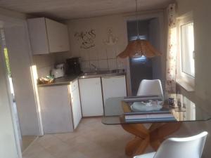 Η κουζίνα ή μικρή κουζίνα στο Fabian Comfortable holiday residence