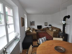 a living room with a table and a couch at Haus Rosa Comfortable holiday residence in Cochem