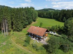 an aerial view of a house in a field at Waldhaus Sonnenberg Apartment 4 in Drachselsried
