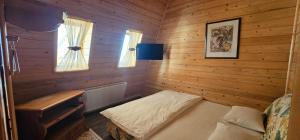 Un pat sau paturi într-o cameră la A&T Harmony Land