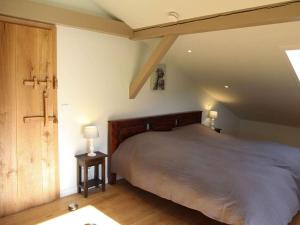 a bedroom with a large bed in a attic at Villa Carefree Suite in Grassau