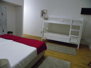 Postel nebo postele na pokoji v ubytování Lagoa Hostel & Suites