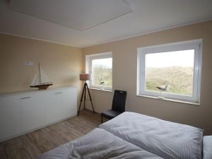 Ένα ή περισσότερα κρεβάτια σε δωμάτιο στο Klabautermann Maywald