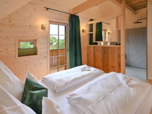 a bedroom with two white beds in a room at Grandma Ludwin 1 Modern retreat in Sasbachwalden