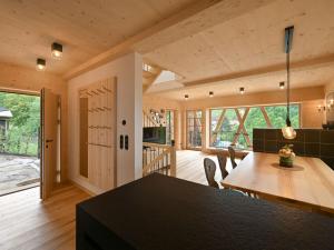 a kitchen and dining room with a table and chairs at Grandma Ludwin 1 Modern retreat in Sasbachwalden