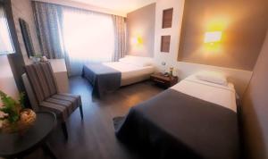 Ένα ή περισσότερα κρεβάτια σε δωμάτιο στο Dedepark Hotel