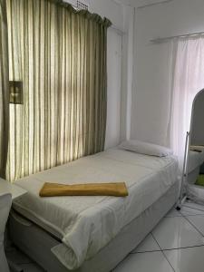 Postel nebo postele na pokoji v ubytování Sunset Guesthouse - Mthatha