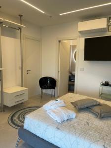Postel nebo postele na pokoji v ubytování B&B Perla sul mare