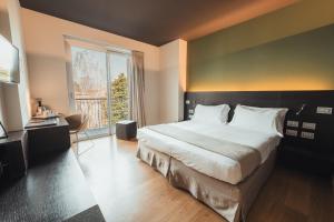 Postel nebo postele na pokoji v ubytování Mod 05 Bike Hotel