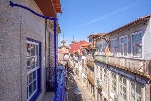 a view of an alley between two buildings at Terro Collection - Anjo in Braga