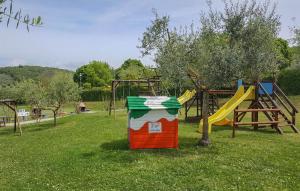 a park with a playground with a slide at Lovely Apartment In San Feliciano in San Feliciano