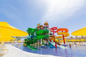 a water park with a water slide in a pool at Beach Albatros The Club - Aqua Park in Hurghada