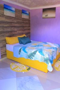 a bedroom with a bed with a surfboard on the floor at Magagula's Guest House and Accomodation in Burgersfort