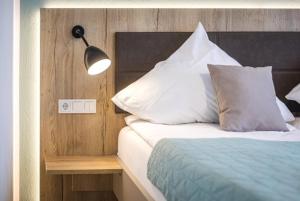 Postel nebo postele na pokoji v ubytování Hotel Lehn