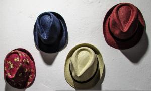 a group of hats hanging on a wall at Magnificent Athens Villa 1 Bedroom Villa Aizen Garden View Ground Floor Platia Agion Asomaton in Athens