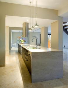 a large kitchen with a sink and a counter at Endorikles Villa in Super Paradise Beach