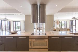 a kitchen with a sink and a counter top at Endorikles Villa in Super Paradise Beach