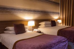 Voodi või voodid majutusasutuse Brandon House Hotel toas