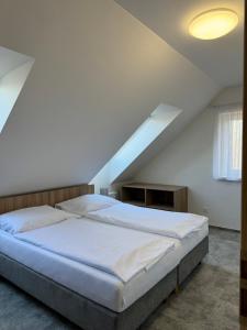 Postel nebo postele na pokoji v ubytování Resort Vila Credo
