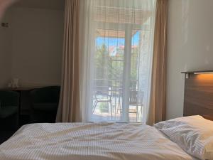 Postel nebo postele na pokoji v ubytování Resort Vila Credo