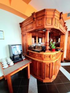 a kitchen with a counter with a microwave and a desk at Hotel Aslan in Tarnowskie Góry