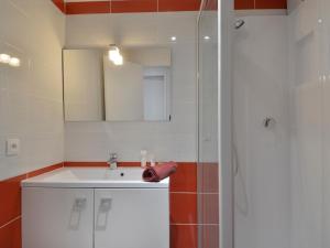 a bathroom with a white sink and a shower at Appartement Plagne Bellecôte, 4 pièces, 8 personnes - FR-1-181-902 in Plagne Bellecote