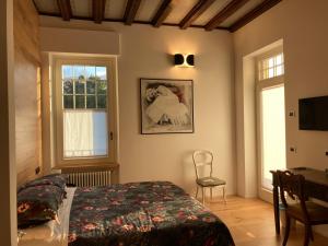 Postel nebo postele na pokoji v ubytování B&B Villa Cortese