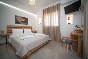 Postel nebo postele na pokoji v ubytování Elixrysos Apartment 2