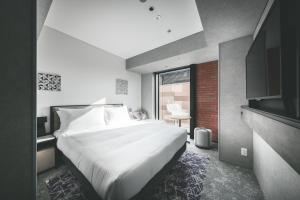 SAPPORO STREAM HOTEL客房内的一张或多张床位