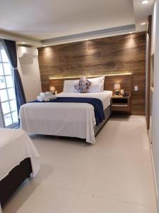 Postel nebo postele na pokoji v ubytování Hotel Pousada Casacolina