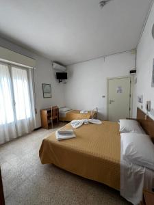 Postel nebo postele na pokoji v ubytování Hotel Till
