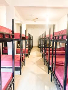 a row of bunk beds in a room at Konfudha Resort in Kalpetta