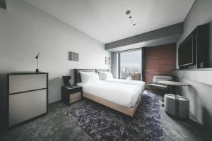 SAPPORO STREAM HOTEL客房内的一张或多张床位