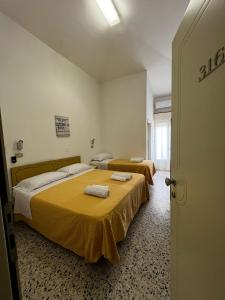 Postel nebo postele na pokoji v ubytování Hotel Till