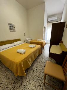 Postel nebo postele na pokoji v ubytování Hotel Till