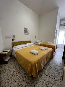 Postel nebo postele na pokoji v ubytování Hotel Till