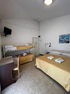 Postel nebo postele na pokoji v ubytování Hotel Till