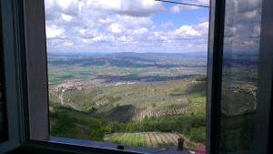 a view from a window of a mountain valley at Casa Galoppa in Trevi