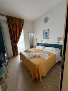 Postel nebo postele na pokoji v ubytování Hotel Till