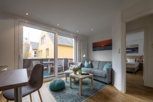 a living room with a couch and a table at Haus Sabina in Helgoland