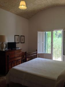 A bed or beds in a room at Relais Masseria Cardillo Még 25 kép