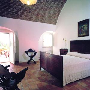 Postel nebo postele na pokoji v ubytování Relais Masseria Cardillo