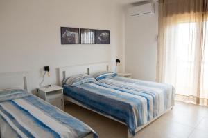Postel nebo postele na pokoji v ubytování Vitti Apartment