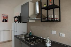 Kuchyň nebo kuchyňský kout v ubytování Vitti Apartment
