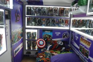 a room filled with lots of figurines and games at Comics Factory Airport & City in Catania