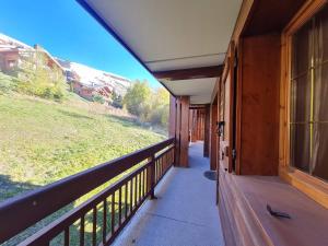 a porch of a house with a view of a field at Balcon des pistes - 217-218 - Appt tout confort 8p in Les Deux Alpes