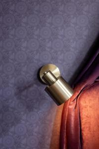 a close up of a metal object sticking out of a curtain at Relais & Châteaux Weeshuis Gouda in Gouda