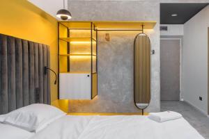 Ένα ή περισσότερα κρεβάτια σε δωμάτιο στο URBAN BUDGET HOTEL