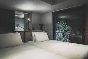 SAPPORO STREAM HOTEL客房内的一张或多张床位